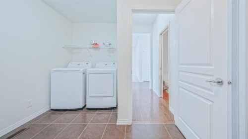 393 Windermere Drive, Chestermere, AB - Indoor Photo Showing Laundry Room