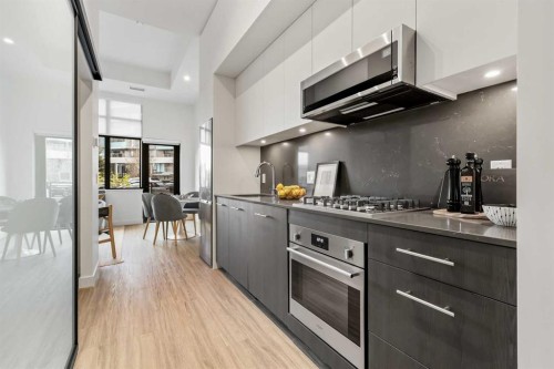 Package #1-730 2 Avenue Sw, Calgary, AB - Indoor Photo Showing Kitchen With Upgraded Kitchen