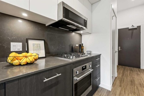 Package #1-730 2 Avenue Sw, Calgary, AB - Indoor Photo Showing Kitchen