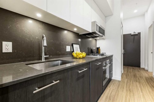 Package #1-730 2 Avenue Sw, Calgary, AB - Indoor Photo Showing Kitchen With Upgraded Kitchen