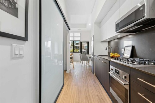 Package #1-730 2 Avenue Sw, Calgary, AB - Indoor Photo Showing Kitchen With Upgraded Kitchen