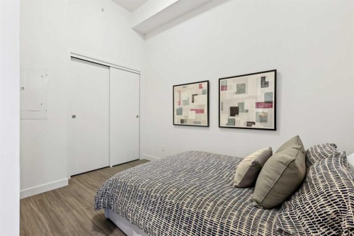 Package #1-730 2 Avenue Sw, Calgary, AB - Indoor Photo Showing Bedroom