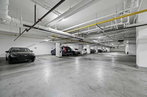 Package #1-730 2 Avenue Sw, Calgary, AB - Indoor Photo Showing Garage