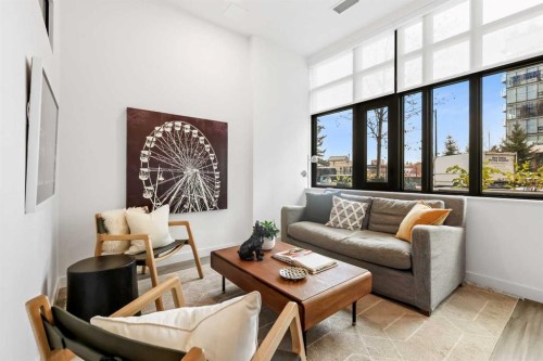 Package #1-730 2 Avenue Sw, Calgary, AB - Indoor Photo Showing Living Room