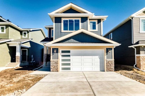 379 Rivercrest Road, Cochrane, AB - Outdoor With Facade