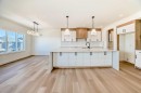 379 Rivercrest Road, Cochrane, AB  - Indoor Photo Showing Kitchen With Upgraded Kitchen 