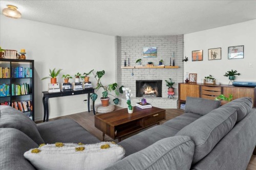 20 Brampton Crescent Sw, Calgary, AB - Indoor Photo Showing Living Room With Fireplace