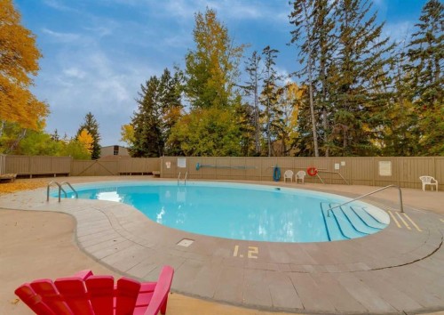 607-8948 Elbow Drive Sw, Calgary, AB - Outdoor With In Ground Pool With Backyard