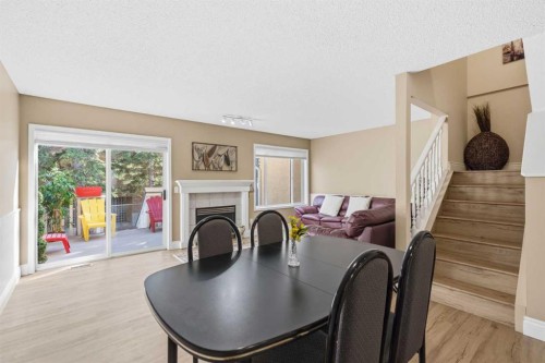 55 Cedarview Mews Sw, Calgary, AB - Indoor Photo Showing Other Room With Fireplace