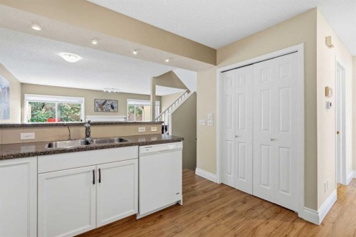 55 Cedarview Mews Sw, Calgary, AB - Indoor Photo Showing Kitchen With Double Sink