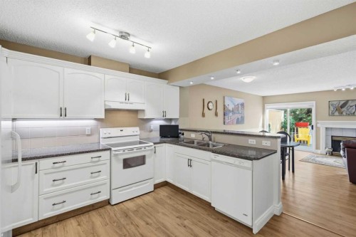 55 Cedarview Mews Sw, Calgary, AB - Indoor Photo Showing Kitchen With Double Sink