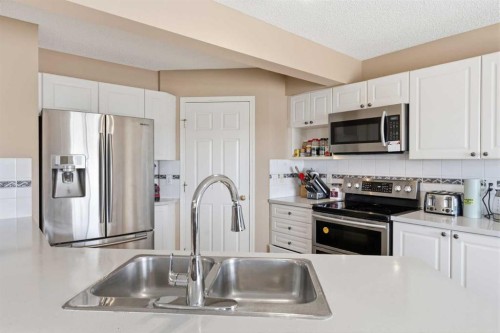 21 Panamount Crescent Nw, Calgary, AB - Indoor Photo Showing Kitchen With Double Sink