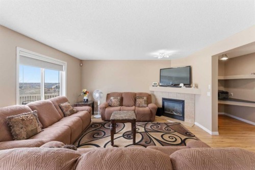 21 Panamount Crescent Nw, Calgary, AB - Indoor Photo Showing Living Room With Fireplace