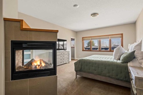 3924 15A Street Sw, Calgary, AB - Indoor Photo Showing Bedroom With Fireplace