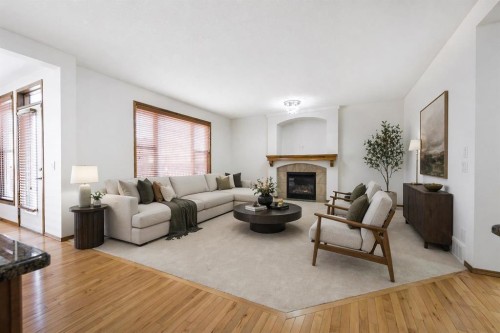 125 Autumn Gardens Se, Calgary, AB - Indoor Photo Showing Living Room With Fireplace