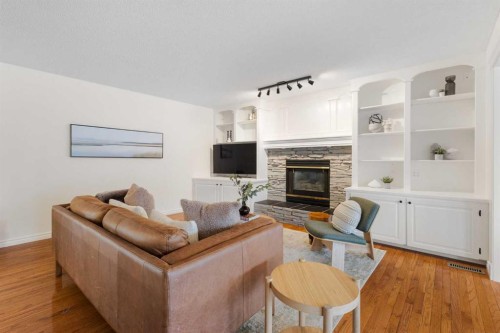 66 Inverness Close Se, Calgary, AB - Indoor Photo Showing Living Room With Fireplace
