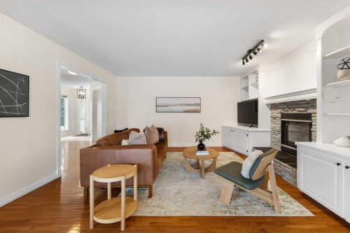 66 Inverness Close Se, Calgary, AB - Indoor Photo Showing Living Room With Fireplace