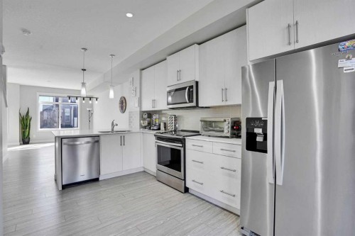 104 Legacy Path Se, Calgary, AB - Indoor Photo Showing Kitchen With Stainless Steel Kitchen With Upgraded Kitchen