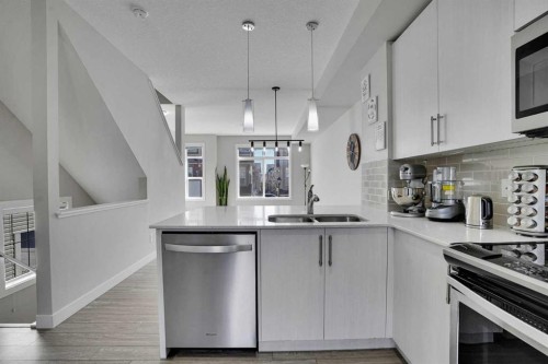 104 Legacy Path Se, Calgary, AB - Indoor Photo Showing Kitchen With Double Sink