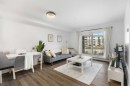 3107-11 Mahogany Row Se, Calgary, AB  - Indoor Photo Showing Living Room 