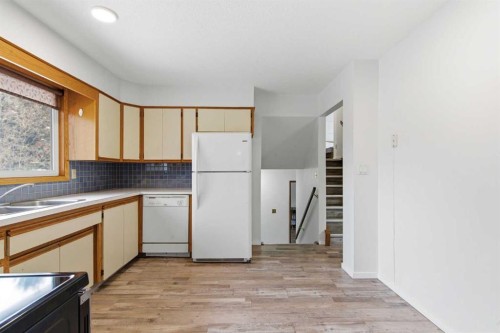5048 Dalhart Road Nw, Calgary, AB - Indoor Photo Showing Kitchen With Double Sink