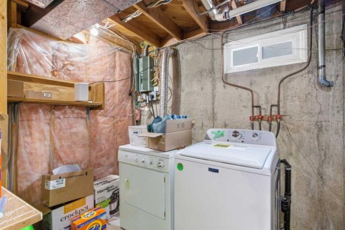 5048 Dalhart Road Nw, Calgary, AB - Indoor Photo Showing Laundry Room