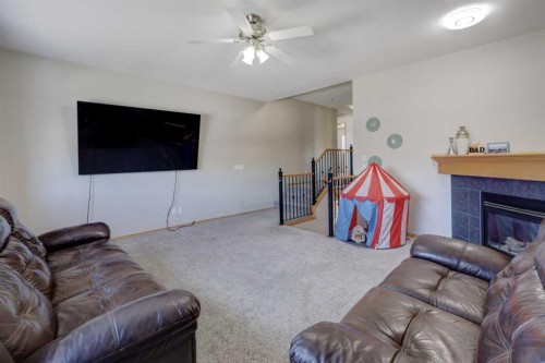 17 Royal Birch Way Nw, Calgary, AB - Indoor Photo Showing Living Room With Fireplace