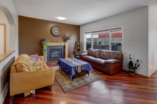 17 Royal Birch Way Nw, Calgary, AB - Indoor Photo Showing Living Room With Fireplace