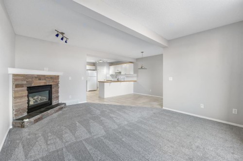 45 Country Hills Crescent Nw, Calgary, AB - Indoor Photo Showing Living Room With Fireplace