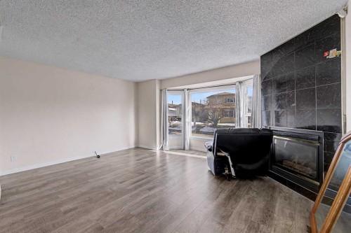 48 Whitworth Way Ne, Calgary, AB - Indoor With Fireplace