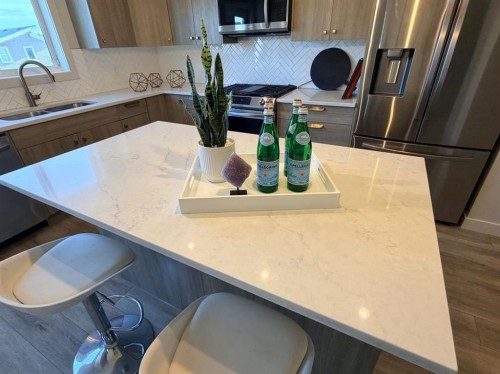 224 River Heights Drive, Cochrane, AB - Indoor Photo Showing Kitchen With Double Sink
