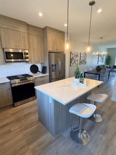 224 River Heights Drive, Cochrane, AB - Indoor Photo Showing Kitchen With Upgraded Kitchen