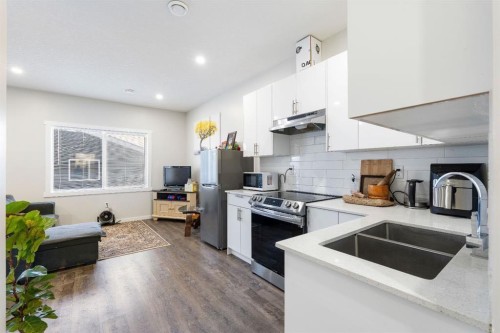 224 River Heights Drive, Cochrane, AB - Indoor Photo Showing Kitchen With Double Sink
