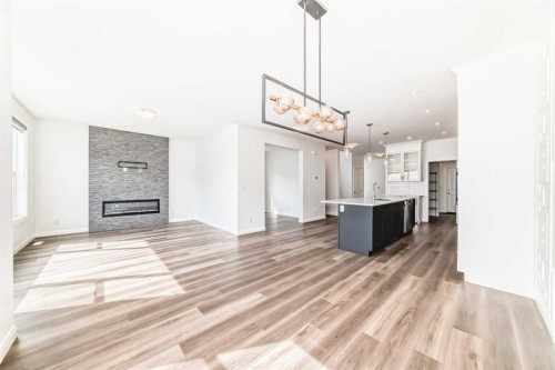 84 Evansfield Close Nw, Calgary, AB - Indoor Photo Showing Living Room With Fireplace