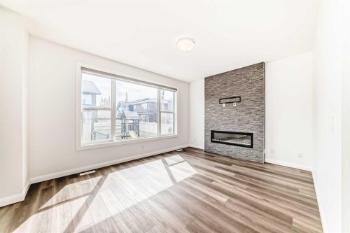 84 Evansfield Close Nw, Calgary, AB - Indoor Photo Showing Living Room With Fireplace