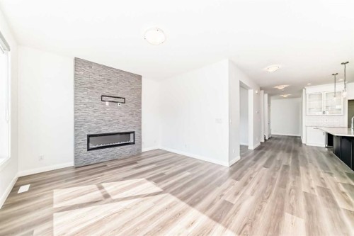 84 Evansfield Close Nw, Calgary, AB - Indoor Photo Showing Living Room With Fireplace