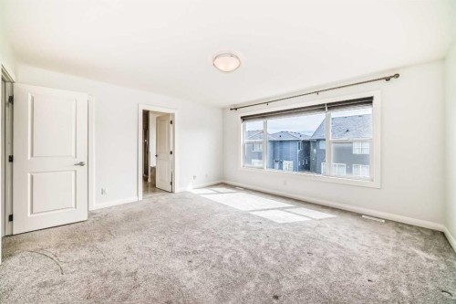 84 Evansfield Close Nw, Calgary, AB - Indoor Photo Showing Other Room