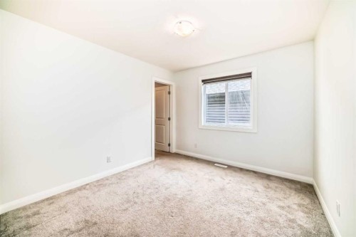 84 Evansfield Close Nw, Calgary, AB - Indoor Photo Showing Other Room
