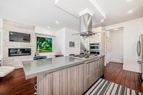 2412 28 Avenue Sw, Calgary, AB - Indoor Photo Showing Kitchen With Fireplace