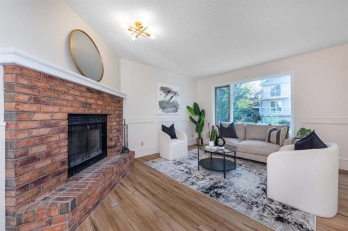 47 Hawkstone Drive Nw, Calgary, AB - Indoor Photo Showing Living Room With Fireplace
