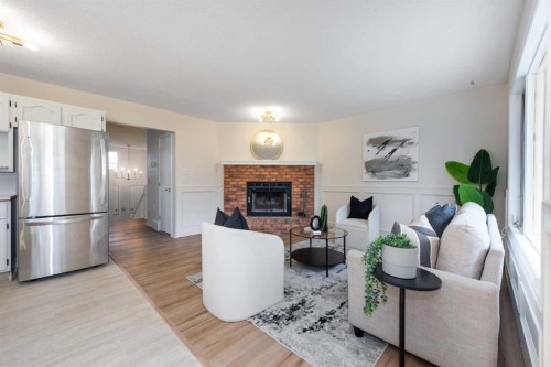 47 Hawkstone Drive Nw, Calgary, AB - Indoor Photo Showing Living Room With Fireplace