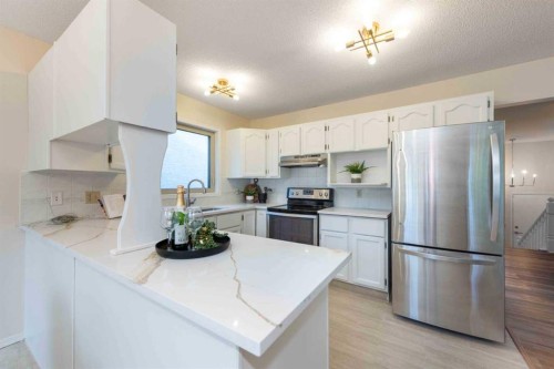 47 Hawkstone Drive Nw, Calgary, AB - Indoor Photo Showing Kitchen With Stainless Steel Kitchen