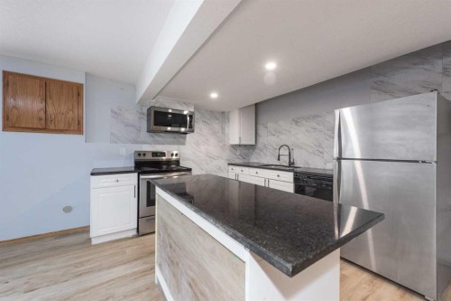 47 Hawkstone Drive Nw, Calgary, AB - Indoor Photo Showing Kitchen With Stainless Steel Kitchen With Upgraded Kitchen