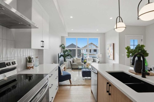 85 Wild Rose Way Se, Calgary, AB - Indoor Photo Showing Kitchen With Double Sink With Upgraded Kitchen