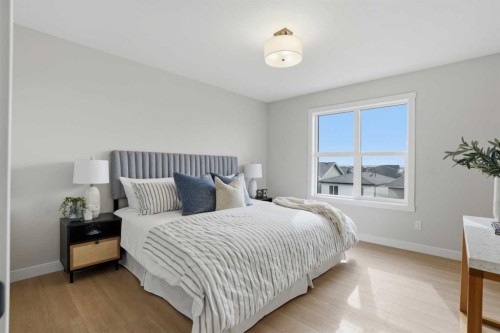 85 Wild Rose Way Se, Calgary, AB - Indoor Photo Showing Bedroom
