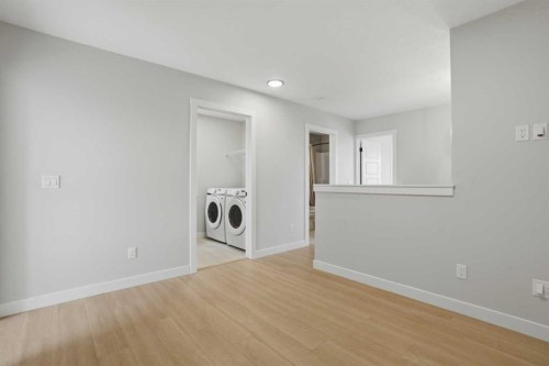 85 Wild Rose Way Se, Calgary, AB - Indoor Photo Showing Laundry Room