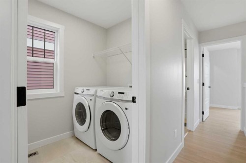 85 Wild Rose Way Se, Calgary, AB - Indoor Photo Showing Laundry Room