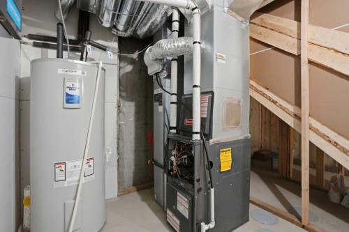 85 Wild Rose Way Se, Calgary, AB - Indoor Photo Showing Basement