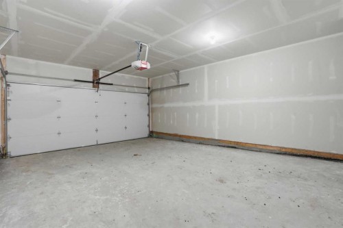 85 Wild Rose Way Se, Calgary, AB - Indoor Photo Showing Garage