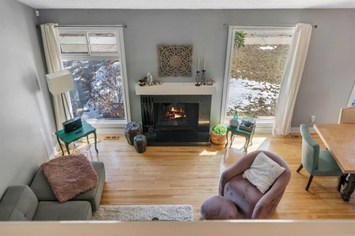 12 Oakvale Place Sw, Calgary, AB - Indoor Photo Showing Living Room With Fireplace